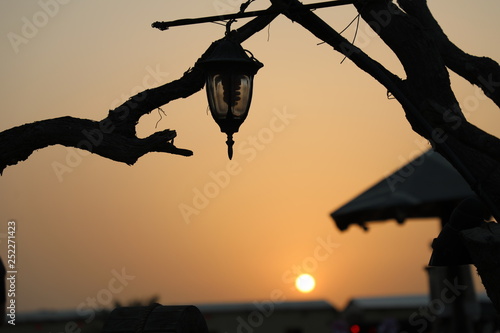 silhouette of lamp in sunset