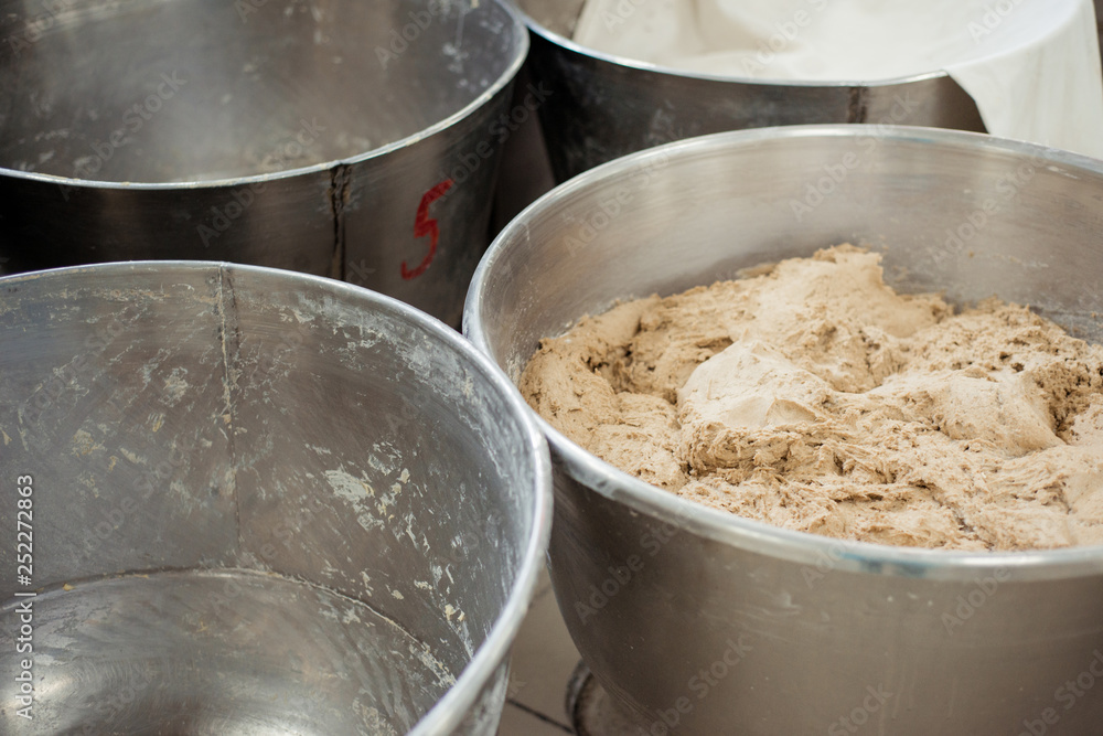 Fototapeta premium Making dough for bread in a bakery