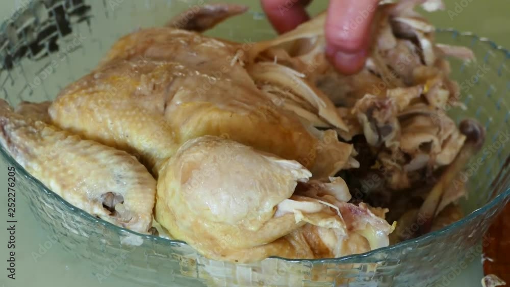 A woman takes off his boiled chicken meat,boiled whole chicken, boiled chicken meat, boiled chicken breast meat, A woman takes off his boiled chicken meat,boiled whole chicken, boiled chicken meat, boiled chicken breast meat,
