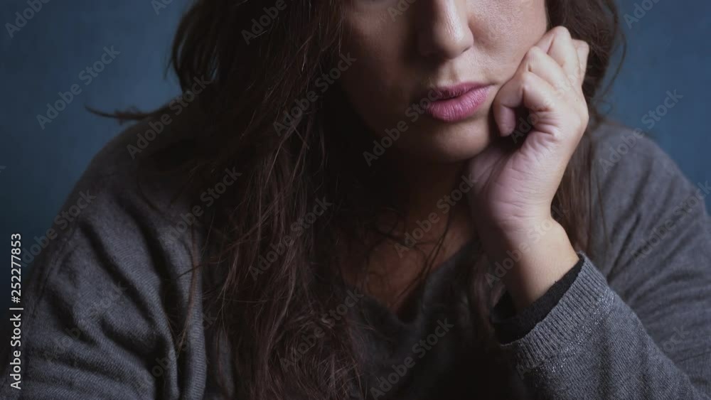 Sad pensive lonely woman loooking at camera-indoor Sad pensive lonely woman loooking at camera-indoor