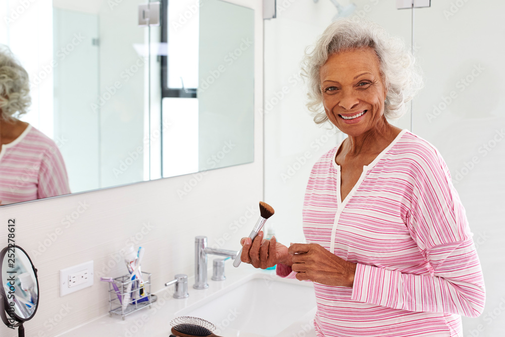 Portrait Of Senior Woman In Bathroom Putting On Make Up Portrait Of Senior Woman In Bathroom Putting On Make Up