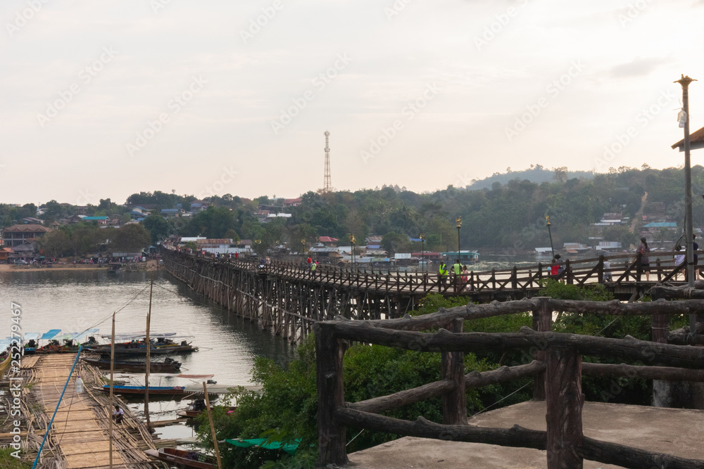 Tourists crowded on Wooden Mon Bridge at kanchanaburi, Thailand