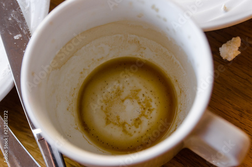 a dirty cup with coffee