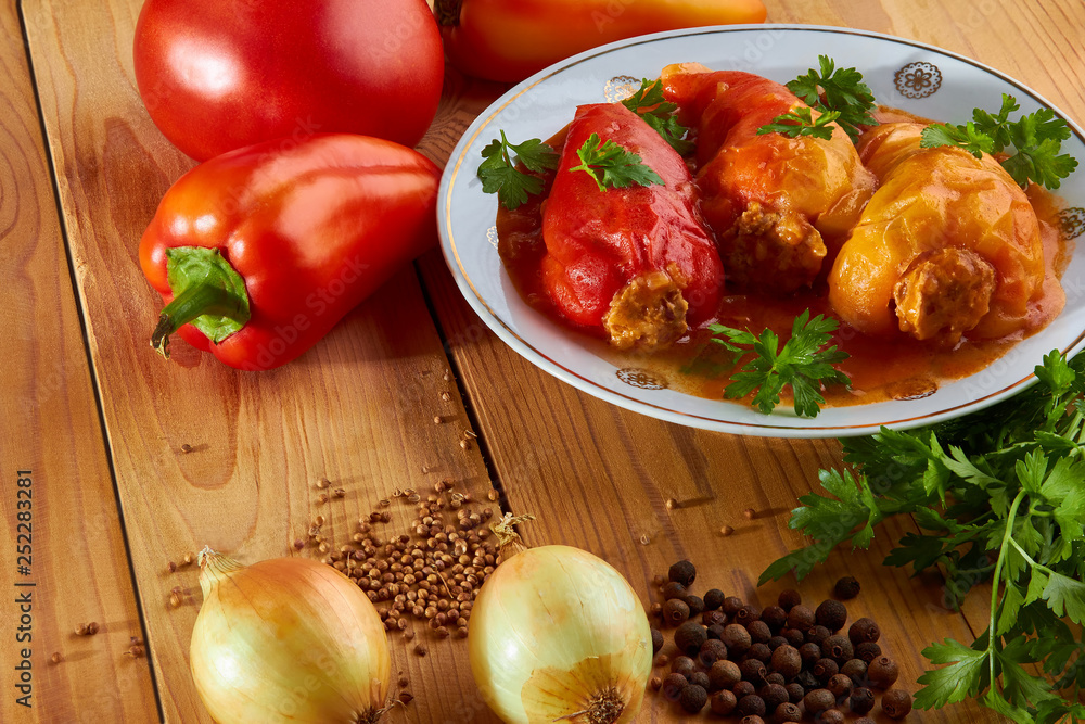 Stuffed peppers: rice with meat and spices in tomato sauce - delicious food. Stuffed peppers: rice with meat and spices in tomato sauce - delicious food.
