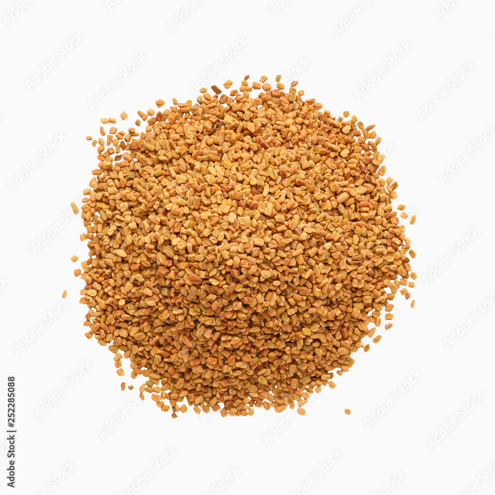 Brown aromatic fenugreek seeds isolated on white background Brown aromatic fenugreek seeds isolated on white background