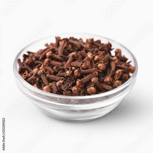 Heap of dried cloves isolated on white