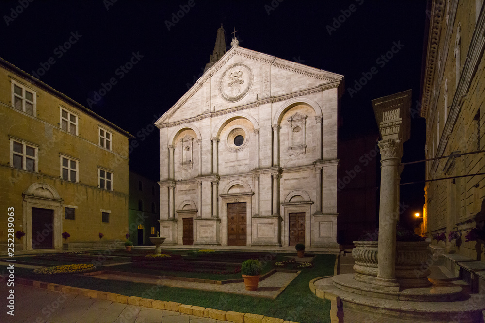 Santa Maria Assunta on the Piazza Pio II by night. Night view on the Roman Catholic cathedral in Pienza dedicated to the Assumption of the Virgin Mary, Pienza, Tuscany, Italy