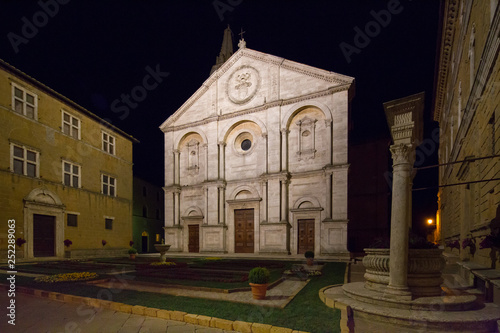 Santa Maria Assunta on the Piazza Pio II by night. Night view on the Roman Catholic cathedral in Pienza dedicated to the Assumption of the Virgin Mary, Pienza, Tuscany, Italy