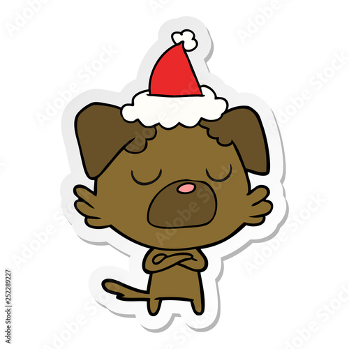 sticker cartoon of a dog wearing santa hat © lineartestpilot