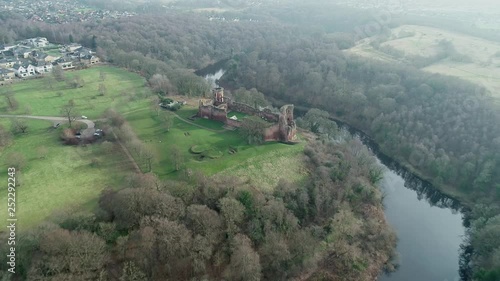 Aerial footage of Bothwell Castle near Uddingston in Scotland. Dramatic location by a winding curve in the River Clyde. photo