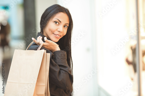 Attractive African mature female enjoying shopping