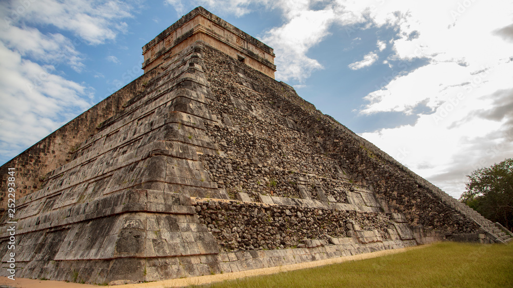 The mighty nine level stone pyramid of Temple of Kukulcan or El Castillo on the Chichen Itza archaeology site