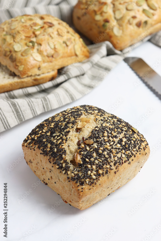 Freshly baked square shaped buns with seeds