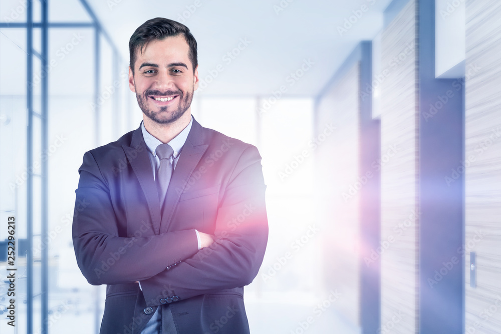 Smiling confident businessman in office Smiling confident businessman in office