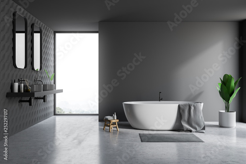 Gray bathroom interior, tub and sinks
