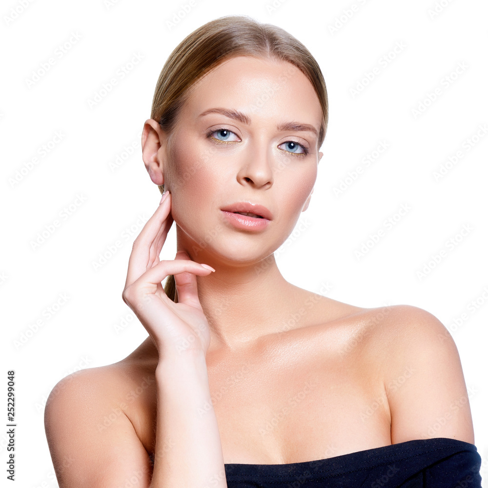 Beauty Portrait. Beautiful Spa Woman Touching her Face. Perfect Fresh Skin. Isolated on White Background. Pure Beauty Model. Youth and Skin Care Concept