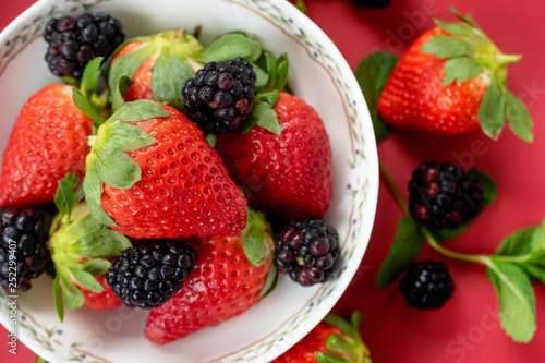 strawberries and blackberries in a bowl