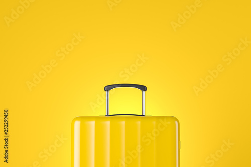Yellow suitcase close up over yellow