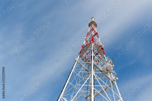 Abstract telecommunication tower Antenna and satellite dish at sky background