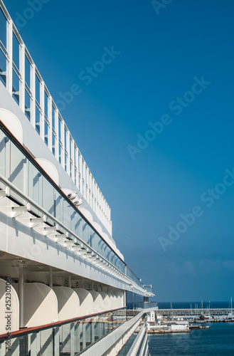 Side view of cruise ship against blue sky.
