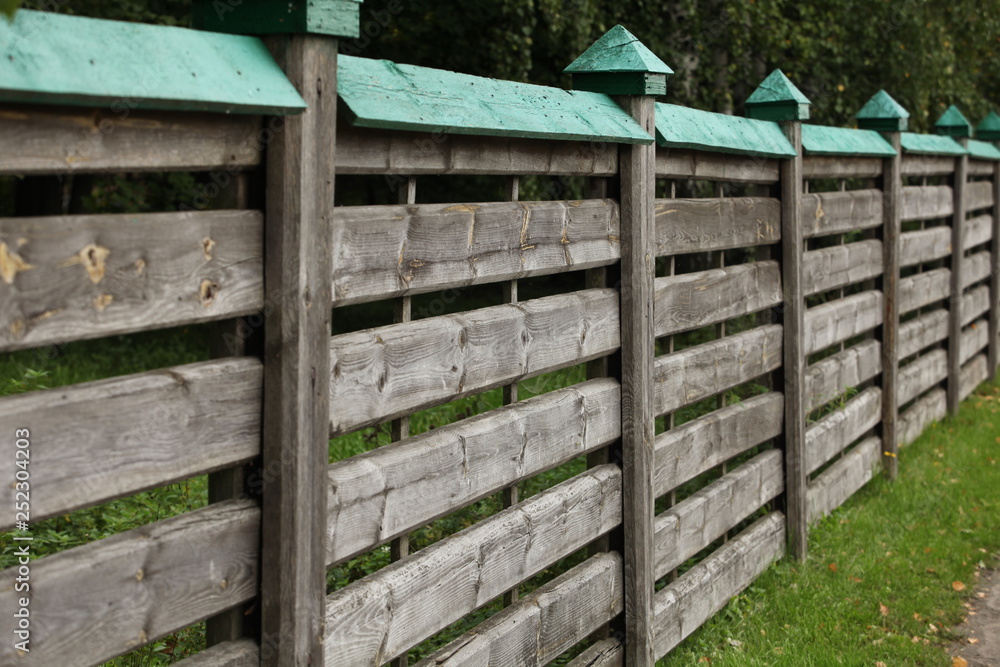 Wooden fence stretching into the distance