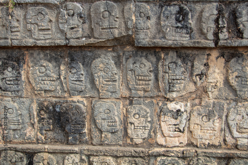 Tzompantli or Wall of Skulls platform structure found on the grounds of Chichen Itza
