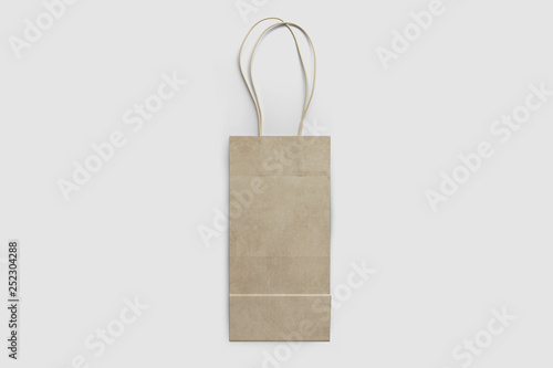 Brown paper shopping bag Mock-up on soft gray background.Сan be used for design and branding