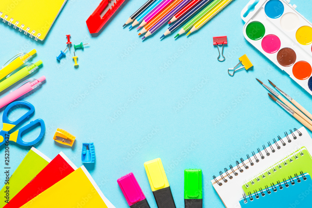 School and office supplies on blue background. School and office supplies on blue background.