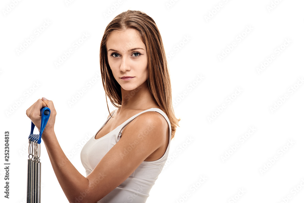 Fit healthy woman training with expander on white background Fit healthy woman training with expander on white background