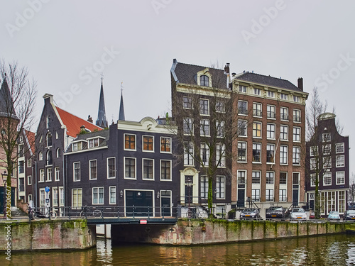 Amsterdam cityscape in the month of January with canals and leaning old houses
