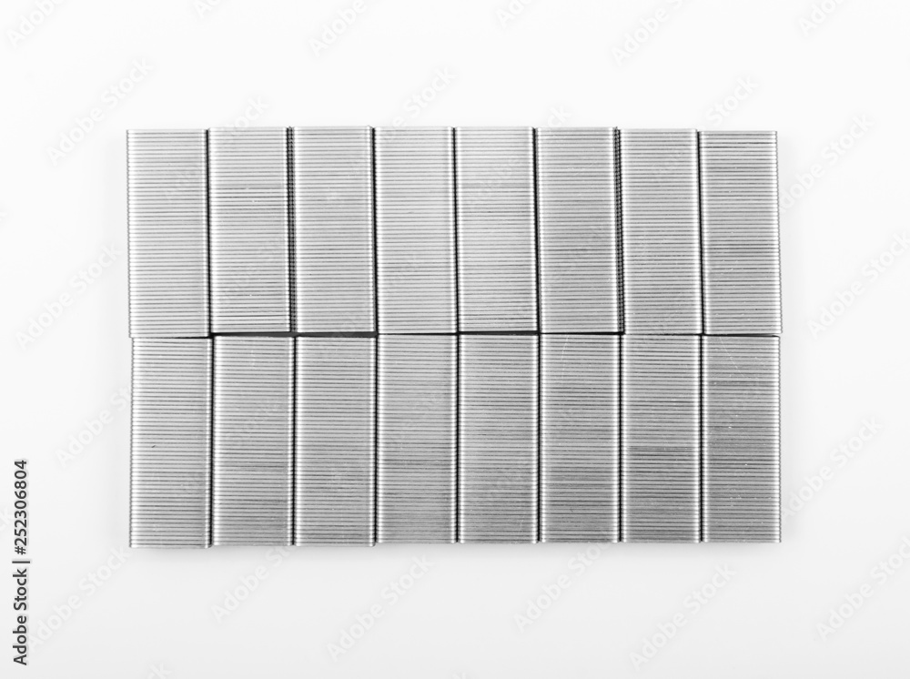 Stack of New Metal Staples for Stapler on White Stack of New Metal Staples for Stapler on White