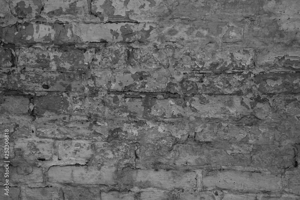 Texture of black and white brick with scratches and cracks