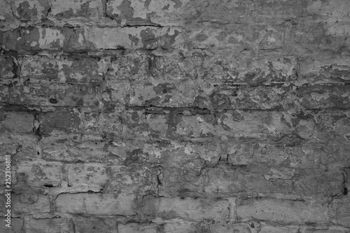 Texture of black and white brick with scratches and cracks