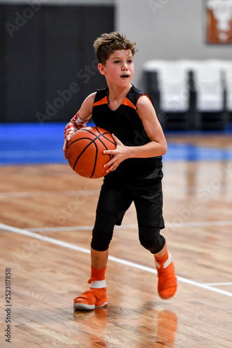 Young boy playing basketball Stock Photo