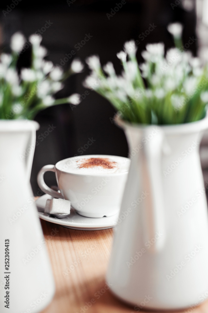Cup of cappuccino on a wooden table Cup of cappuccino on a wooden table