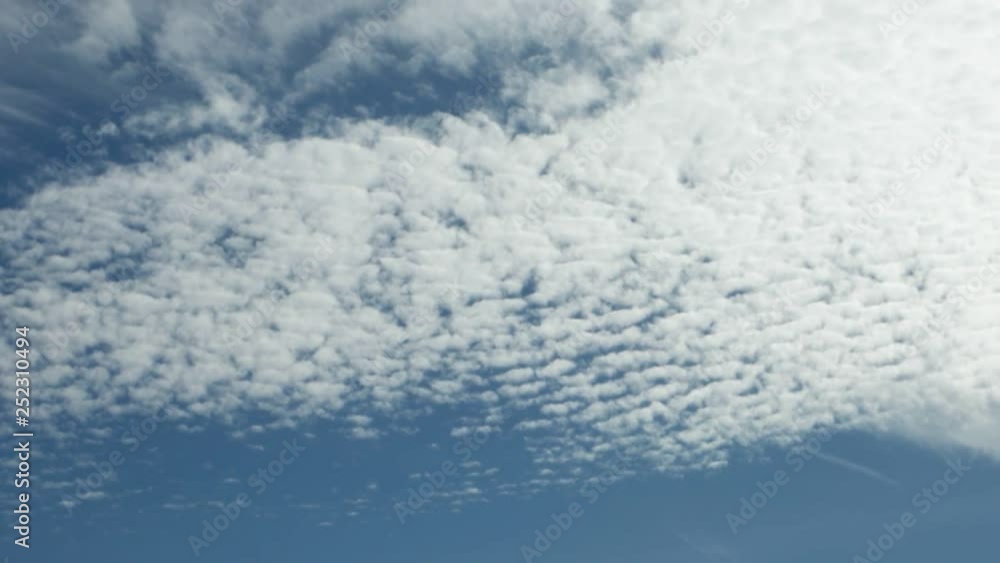 Cirro-cumulus on blue sky, background, time lapse Cirro-cumulus on blue sky, background, time lapse