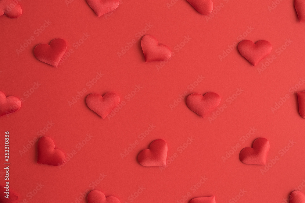 Flat lay of hearts decoration on red background abstract.
