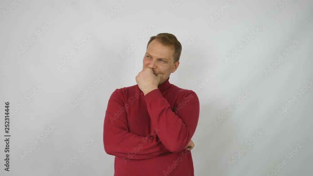 Young handsome man in red sweater posing for the camera.Handsome emotional man. A young man expressing different emotions. Emotions of the face and hands of a handsome guy. Male emotions. handsome man Young handsome man in red sweater posing for the camera.Handsome emotional man. A young man expressing different emotions. Emotions of the face and hands of a handsome guy. Male emotions. handsome man