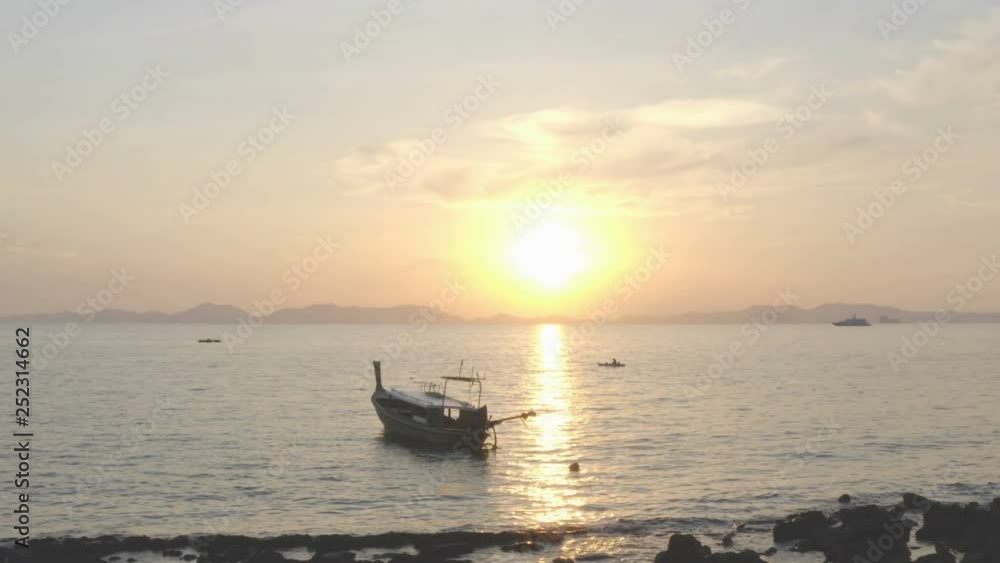 aerial view the unseen tree in sunset the old tree on the rock beside the beach at Kwang beach Krabi Thailand aerial view the unseen tree in sunset the old tree on the rock beside the beach at Kwang beach Krabi Thailand