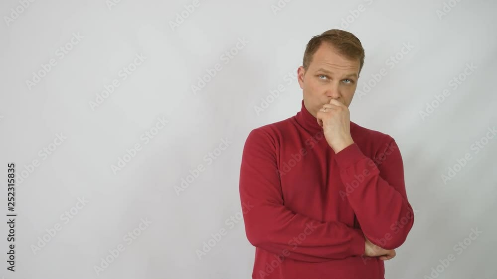 Young handsome man in red sweater posing for the camera.Handsome emotional man. A young man expressing different emotions. Emotions of the face and hands of a handsome guy. Male emotions. handsome man Young handsome man in red sweater posing for the camera.Handsome emotional man. A young man expressing different emotions. Emotions of the face and hands of a handsome guy. Male emotions. handsome man