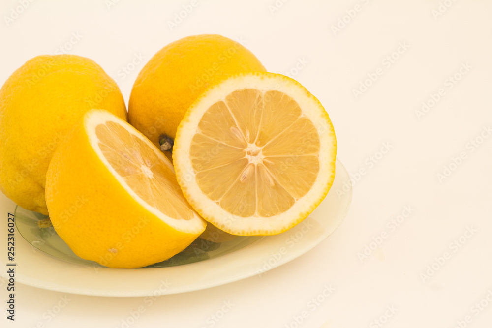 Lemon on a white background and in a cut. Lemon on a white background and in a cut.
