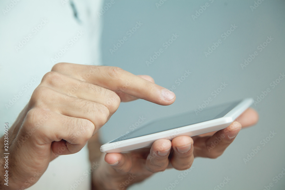 in the hand of a young guy tablet in the hand of a young guy tablet
