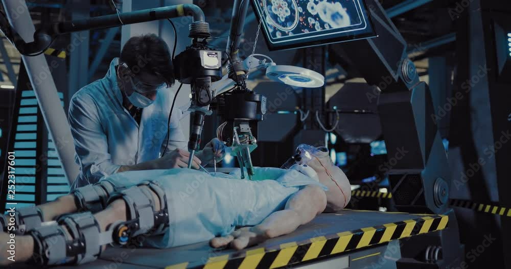 Young doctor surgeon makes an experiment on an alien. Doctor does an autopsy using surgical tools and equipment. Young doctor surgeon makes an experiment on an alien. Doctor does an autopsy using surgical tools and equipment.