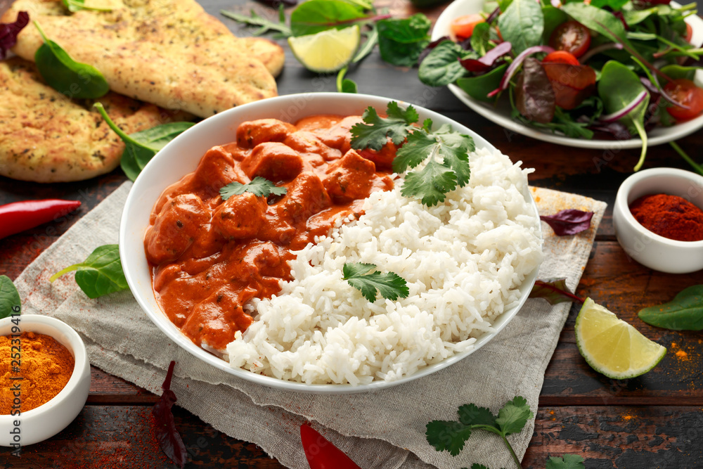 Chicken tikka masala curry with rice and naan bread Chicken tikka masala curry with rice and naan bread