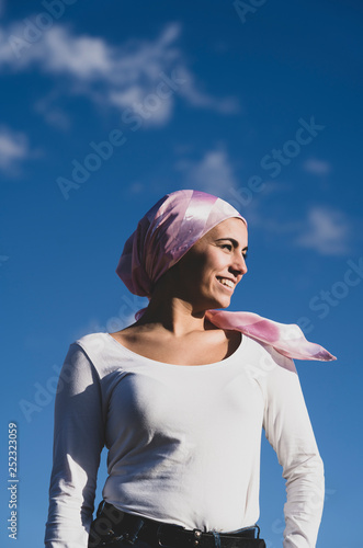 Young beautiful woman with cancer bandana