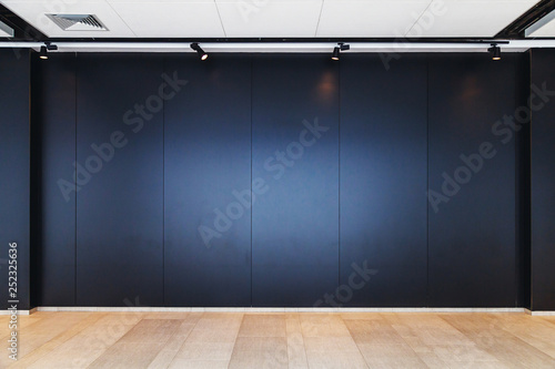 wooden floor and black wall interior background © fedorovekb