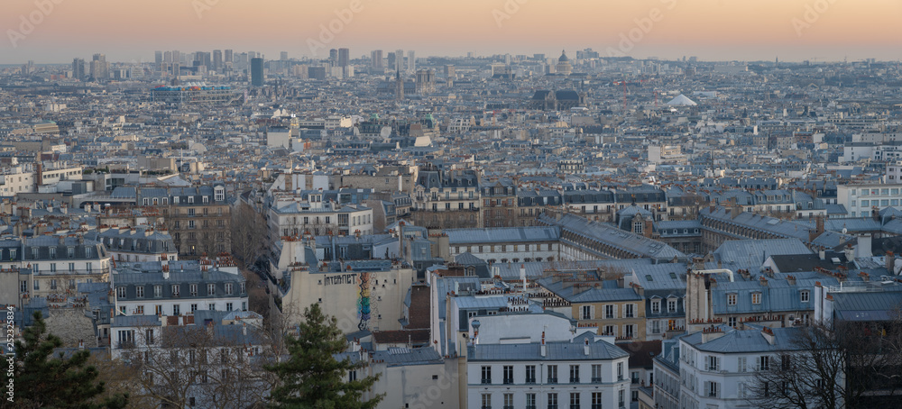 Paris, France - 02 24 2019: Montmartre at sunset. View of Paris from sacred heart