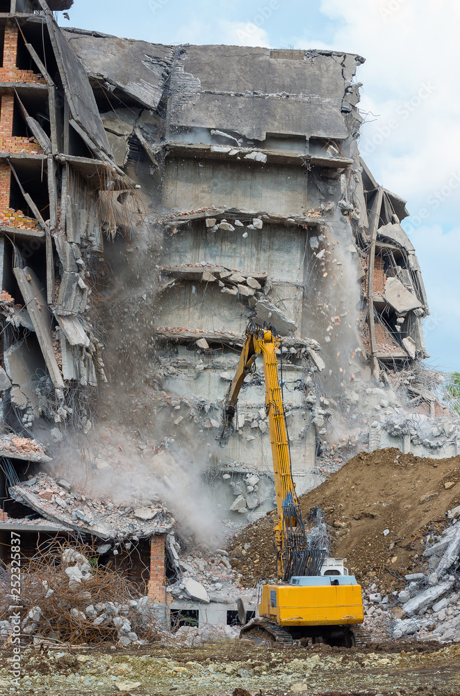 Building demolition with hydraulic excavator Building demolition with hydraulic excavator