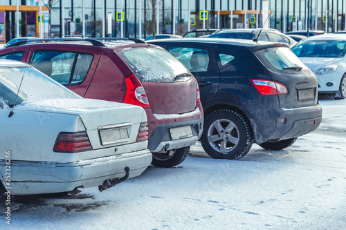 Parked used cars in the parking lot in winter © fedorovekb