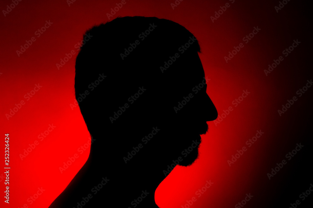 Cleanly defined silhouette of a male person turned to the left
